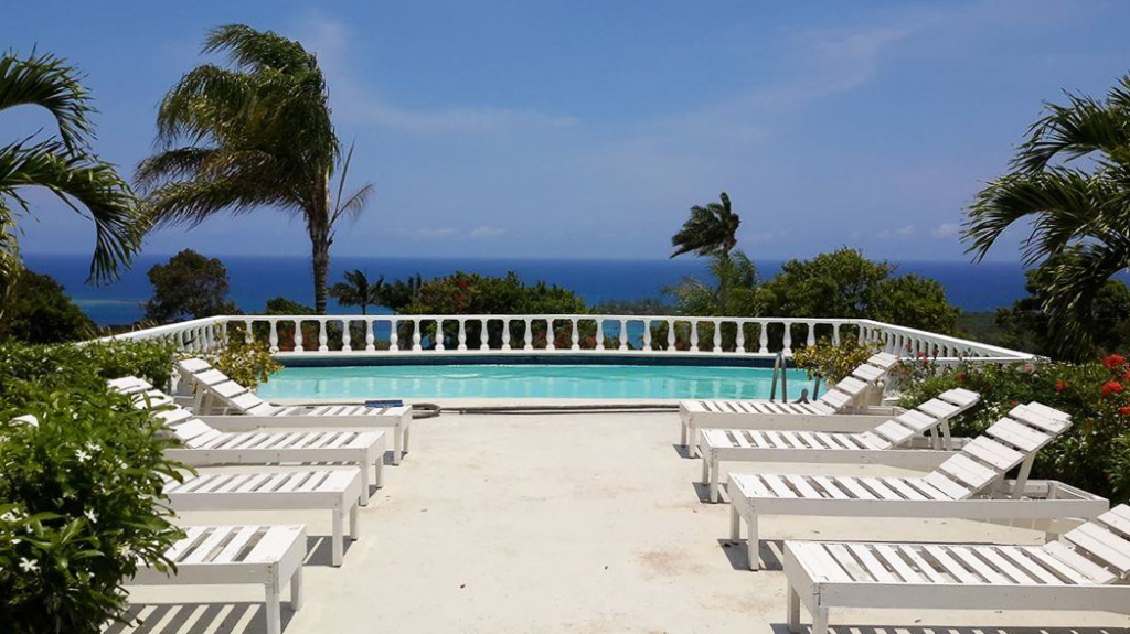 Mount Corbett swimming pool with lounge chairs overlooking the sea